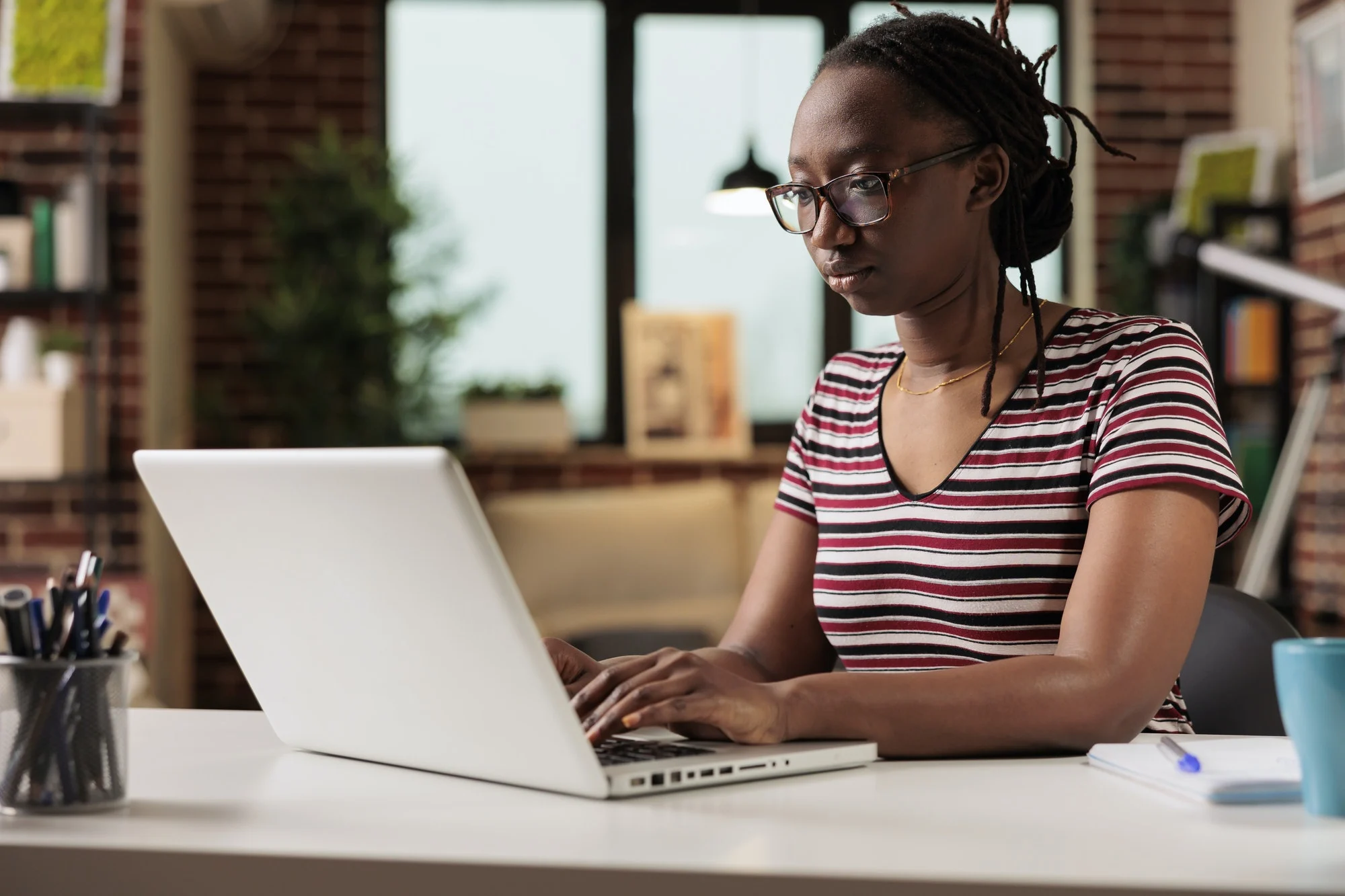 Freelancer working, typing on laptop keyboard, searching information